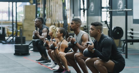 Fitness, kettlebell and row with people in gym together for class, course or training routine